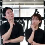 悩みを共有する男女のアジア人ジムスタッフ